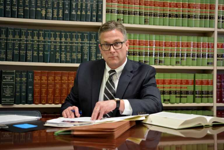 Ehle working on a criminal case at desk